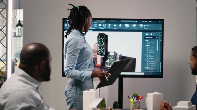 Black property developer discussing residential project investment and strategy for infrastructure growth and city planning in a bright office, analyzing blueprints and 3D models. Camera B.