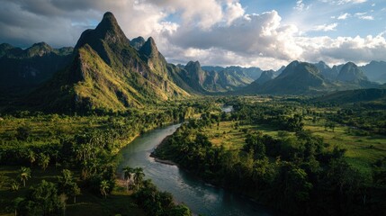 Fototapeta premium Aerial View Of River Winding Through Lush Mountain Valley