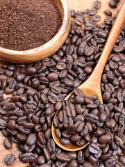 Fototapeta premium Flatlay of coffee beans and wooden spoon.
