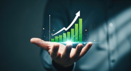 Hand holding a glowing green bar graph with an upward trending arrow symbolizing growth