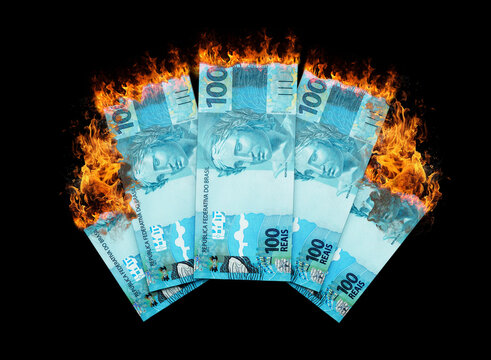 Burning Brazilian real notes