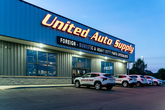Utica, NY - Aug 16, 2025: Night view of United Auto Supply (UAS) is a family-owned and operated wholesale distributor of automotive parts, accessories, and equipment, established in 1946
