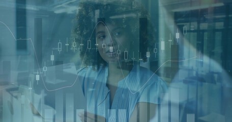 Presenting businesswoman reviewing market data at office, with smartphone and printed documents