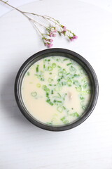 Traditional Korean Seolleongtang Ox Bone Soup on White Background – Authentic Asian Cuisine, Clear Broth with Beef and Noodles