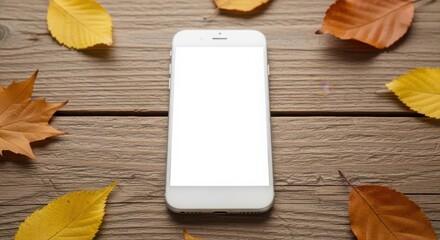A white smartphone with a blank screen is centered on a wooden surface, surrounded by colorful autumn leaves.