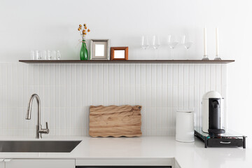 Modern Minimalist Kitchen with White Cabinets and Wooden Floor