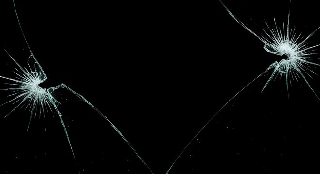 Fragmented Reality: Cracks spiderweb across a sleek, dark expanse, creating a visual representation of fragility and brokenness.