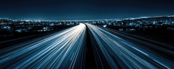 Highway at night with city lights streaking
