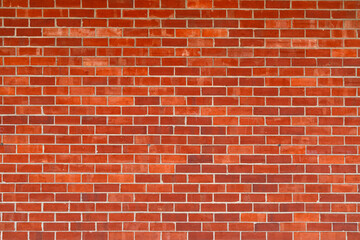 Fototapeta premium Brick wall, vintage texture. Red brick wall for construction themes. Brick wall background. Textured bricks for design projects. Solid bricks structure close-up. Brick wall pattern.