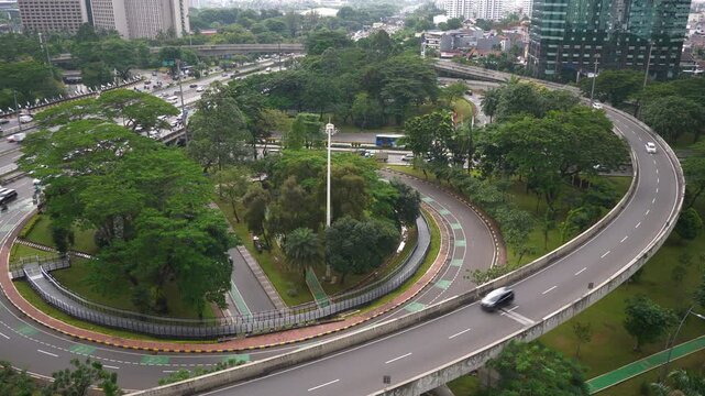 day time jakarta city center traffic street road interchange circle rooftop panorama 4k indonesia