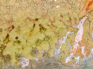 Chemical wastes close up. Dry and cracked ground background. Global warming and climate change. Environmental pollution by chemical waste. Ecological catastrophe