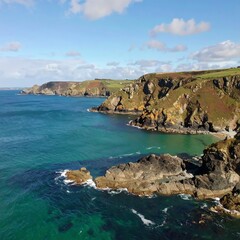 Coastal cliffs meet turquoise sea