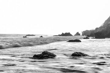 beach and rocks black and white
