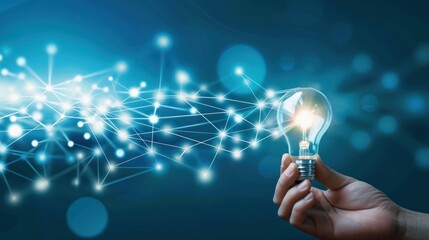 Hand Holding Light Bulb Connecting to Digital Network with Bright Light and Abstract Technology Background