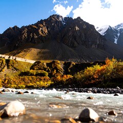 Mountain river scene with autumn colors