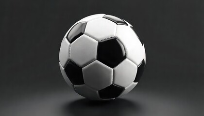 Close up of a soccer ball with black and white panels on a dark gray gradient background surface