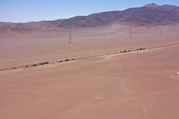 Heavy Trucks Transporting Power Transformer Across Desert Chile