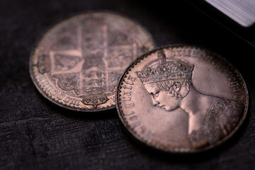 Victoria coin collection featuring old crown coins with queen victorias portrait. Texture detail suitable for historical websites, numismatic blogs.