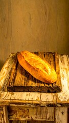 Fresh baked loaf on rustic wooden board