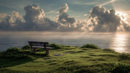 Rustic bench sits atop a grassy hill, gazing out toward a serene ocean view at sunset.