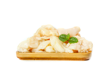 Freshly Diced Chicken in Rich Buttery Sauce on Wooden Plate with Fresh Basil Garnish