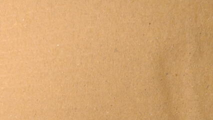 Abstract pattern of beige rough carton, old paper sheet, parchment or papyrus surface, Background of brown kraft paper or cardboard texture.