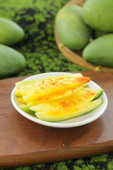 Raw Green Mango Slices with Chili Powder Seasoning - Traditional Asian Fruit Snack from Guangxi
