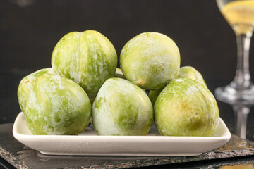 Fresh Sweet Striped Melons on White Plate - Healthy Organic Fruit Display