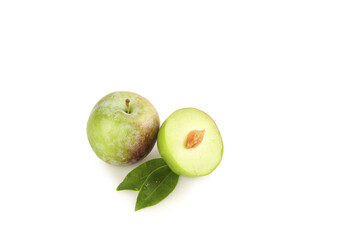 Fresh Green Plums Cut in Half with Leaves on White Background