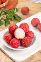 Fresh Chinese Lychees from Lingshan Zengcheng Maoming Gaozhou Regions Showing Sweet Nucleus Flesh on White Plate