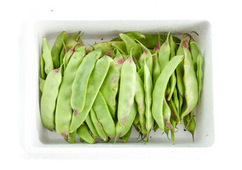 Fresh Green Snap Peas in White Container on Clean Background