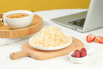 Organic Ginkgo Fungus from Fujian Gutian on Wooden Board with Tea and Fresh Fruits Healthy Breakfast Setup