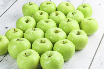Fresh Green Apples from Shaanxi China with Water Drops on White Wood Background
