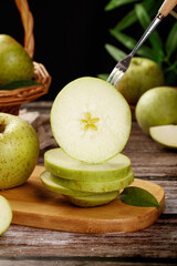Freshly Picked Green Apples from Shandong China Sliced on Wooden Board with Fork