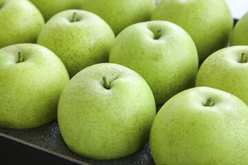 Fresh Green Apples with Natural Light on Jade Background