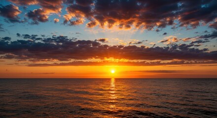 Fototapeta premium Dramatic Sunset Over Calm Ocean Waters
