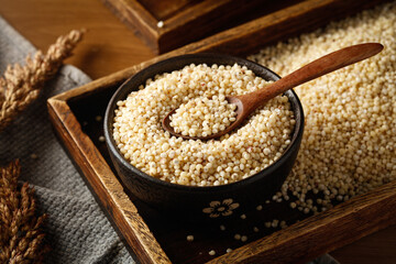 Fresh Sorghum Grain in Wooden Bowl with Wheat Ears - Healthy Gluten-Free Cereal Superfood Ingredient