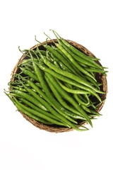 Fresh Green Chili Peppers in Wicker Basket on White Background