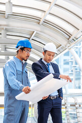 Vertical Horizon Two men engineer look at blueprint architecture building contractor design. Males engineer holding project planing partner teamwork. Vertical Man meeting together construction site