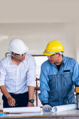 Vertical Horizon Two engineer look at blueprint architecture building contractor design. Two people men woman engineer holding project planing partner teamwork. Vertical construction team meeting