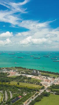 sunny day singapore city industrial bay cargo ship traffic parking aerial vertical panorama k4 timelapse