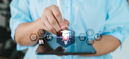 Hand using stylus on tablet with education icons, online learning, e-learning, digital education system, virtual classroom and smart training for academic development. Certification course training.
