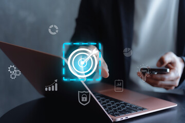 Businessman with target arrow virtual digital technology icon, business investment objectives and goals Marketing strategies and goals for success concept idae.