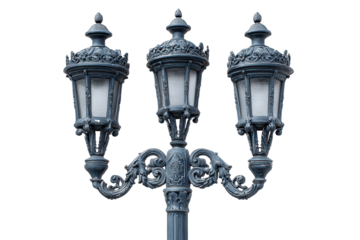 Ornate vintage triple head street lamp post isolated.