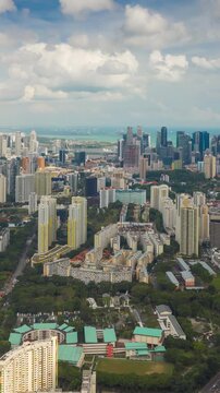 day time singapore cityscape famous living area aerial vertical panorama 4k timelapse