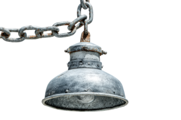 Old industrial metal lamp hanging from a heavy rusty chain.