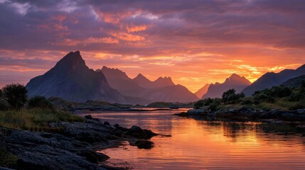 Fototapeta premium Beautiful sunrise over lofoten islands in norway featuring dramatic mountain peaks, calm ocean waters, and scenic nordic landscape under vibrant morning sky