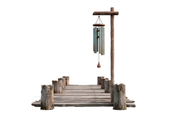 Rustic wooden walkway with hanging metal wind chimes.