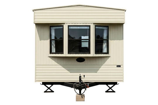 Front view of a beige colored static caravan mobile home isolated on a transparent background