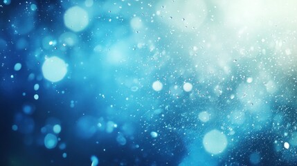 Abstract blue background featuring bokeh effects and glistening droplets patterns